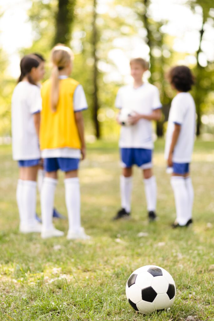 automotive football grass children